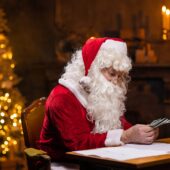 Holiday tips guide, Santa counting cash for holiday tips