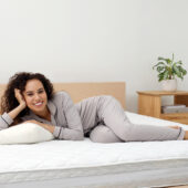 Young women on bed with comfortable mattress