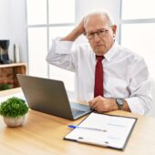 Man using computer laptop confused about estate planning terms