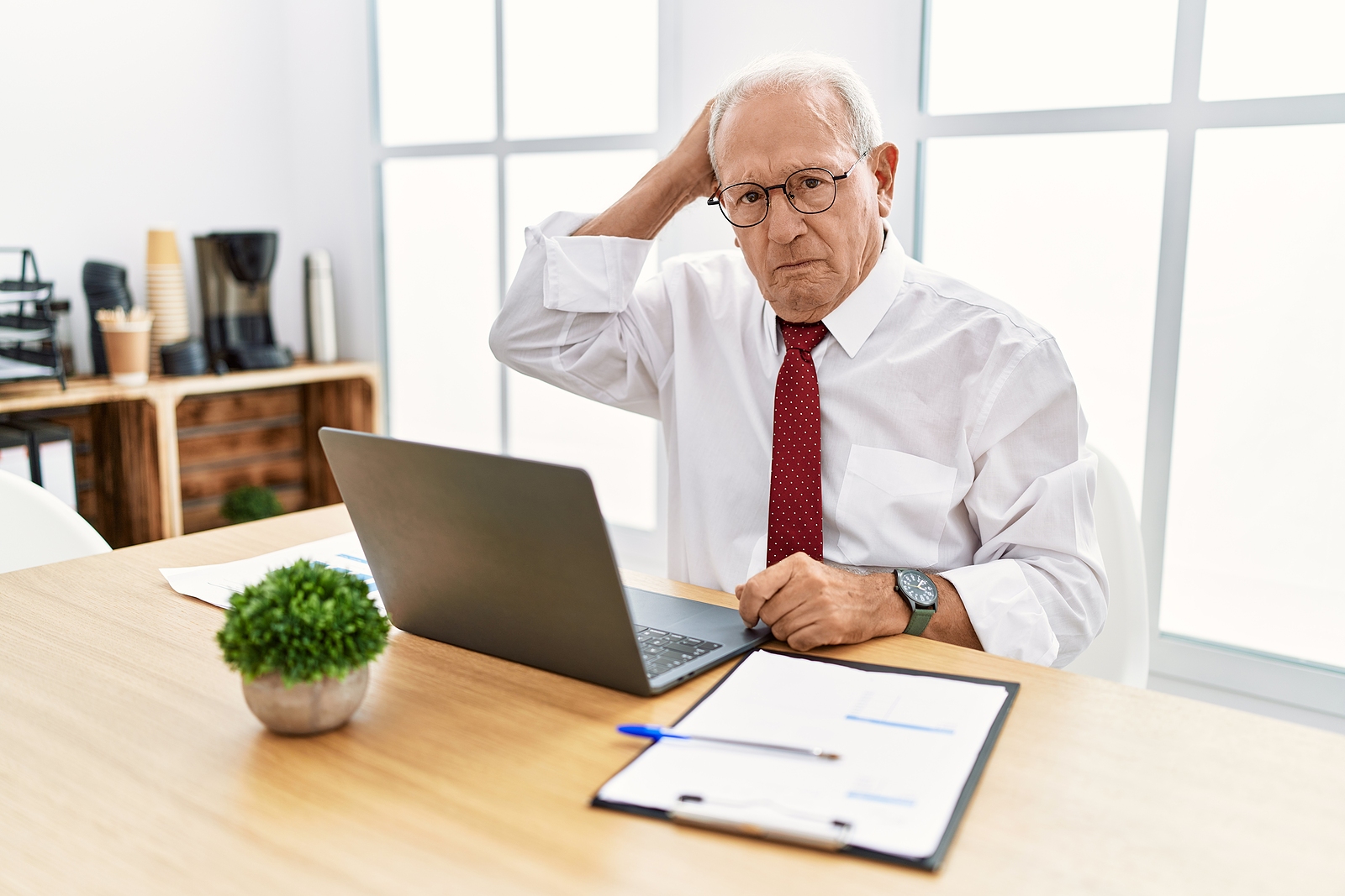 Man using computer laptop confused about estate planning terms